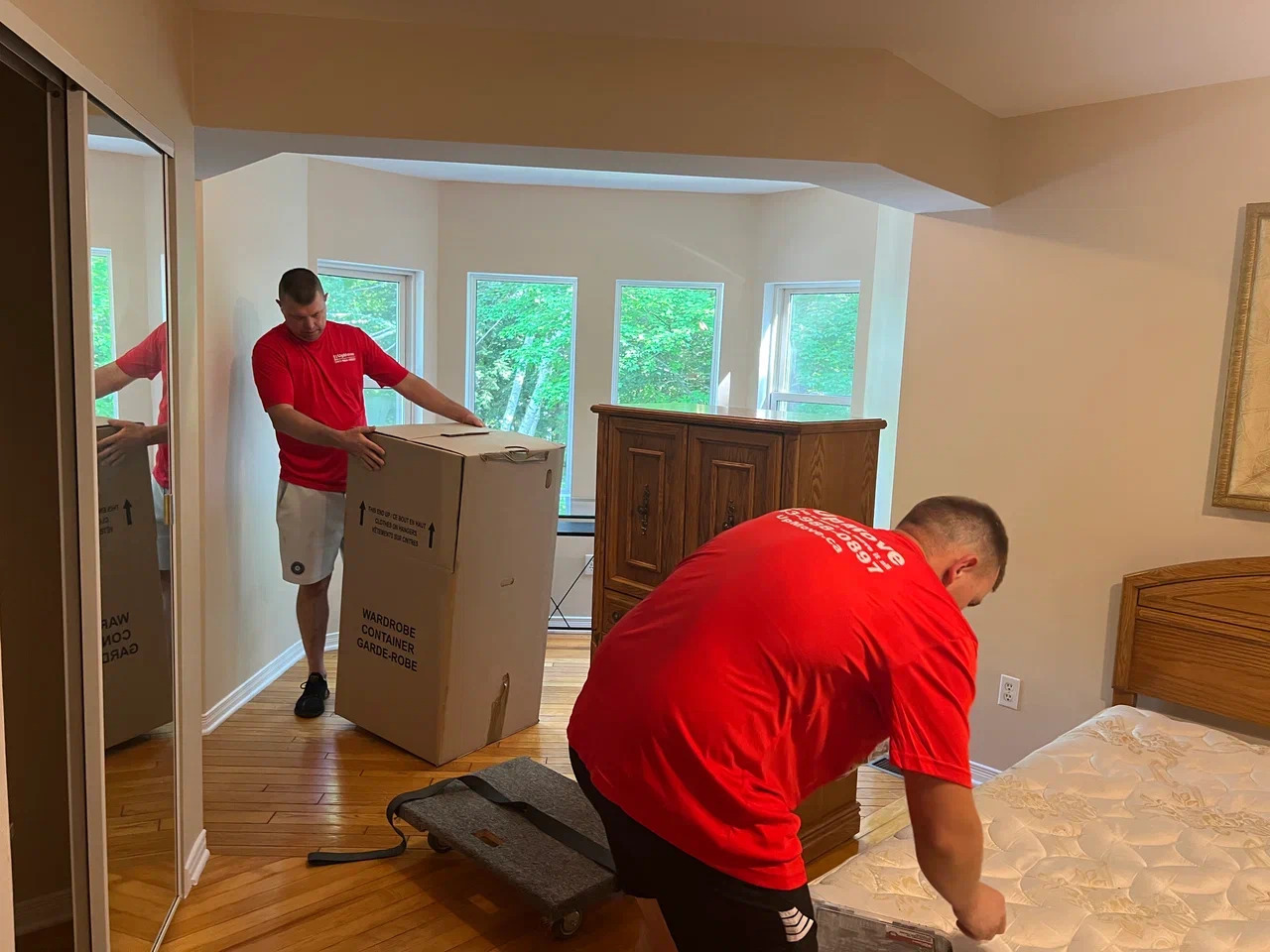 Professional Fast Quality Moving Inc. movers unloading a moving truck